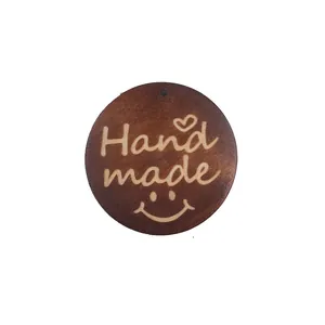 Handmade engraved round wooden tag with smiley face and heart for DIY jewelry making