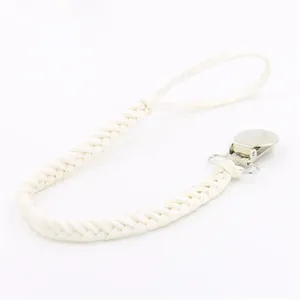 Macro detail of white braided pacifier clip leash with silver metal buckle and loop