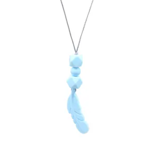 Detail of light blue silicone baby teething necklace with feather pendant and beads