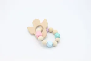 Detailed close-up of baby teething bracelet with beech wood bird and colorful silicone beads
