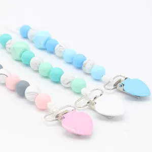 Silicone baby pacifier clips in pastel colors with heart-shaped safety clasps