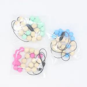 Collier de dentition en silicone pour bébé avec perles en bois et pendentif nœud
