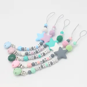 5-pack silicone pacifier clips with macaron beads and baby letter cubes on white background