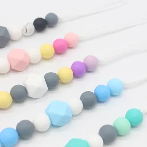 Colorful silicone pacifier clips with round and hexagonal beads in macaron shades