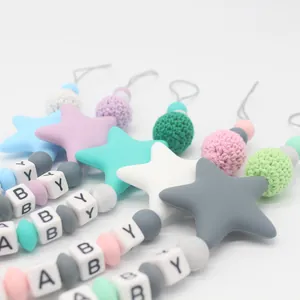 Silicone pacifier clip with macaron beads and BABY letter squares on white background