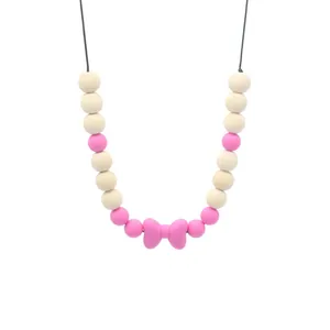 Silikon-Beißkette für Babys in Rosa und Beige mit Schleifenanhänger für zahnende Babys