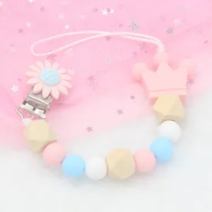 Silicone pacifier clip with macaron beads, wooden beads and pink crown charm