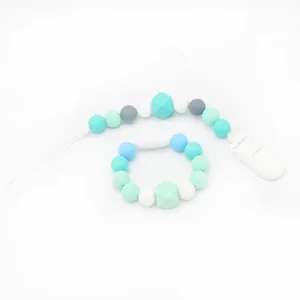 Silicone baby pacifier clip and teething bracelet set in mint green and blue