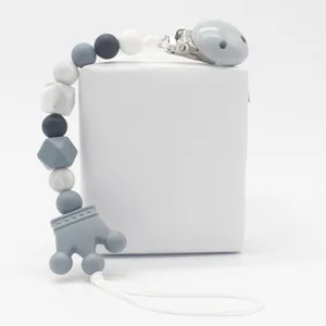 Baby silicone pacifier clip with grey crown teether and marble beads on white background
