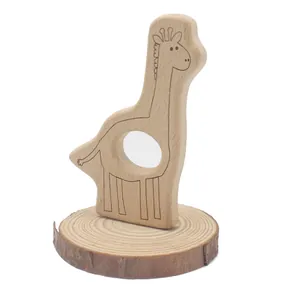 Natural beech wood giraffe baby teether on a rustic wooden base for infant gum relief
