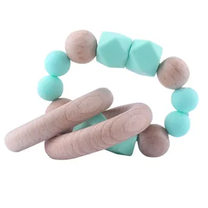 Baby beech wood and mint green silicone teething ring with interlocking rings