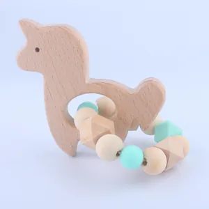 Macro shot of alpaca beech wood teether with mint green silicone and wooden beads