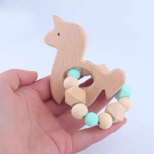 Detail of baby beech wood alpaca teether with mint green silicone and natural wooden beads