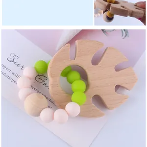 Detail von Holzzahnungshilfe Blatt und Silikonperlenarmband für die Babypflege
