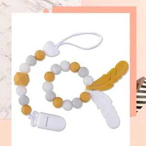 Detail von gelber und Marmor Silikon Schnullerkette mit Feder Beißring für Babys
