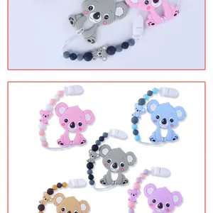 Macro view of koala silicone teether with colorful beads and secure plastic safety clip