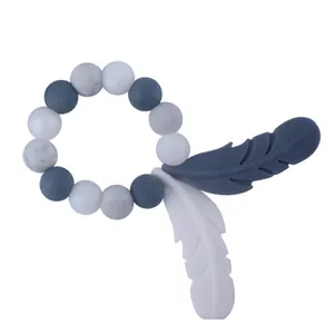 Silicone baby teether ring with marble beads and feather charms for teething relief