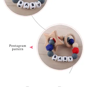 Dettaglio del braccialetto da dentizione per neonati con stella in legno e perline colorate BABY