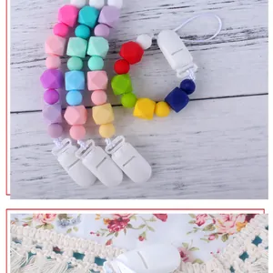 Detail of colorful silicone pacifier clip with round and hexagonal geometric beads