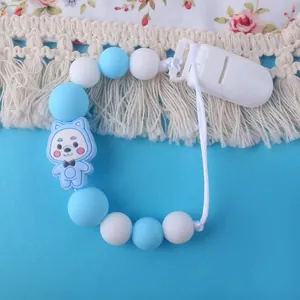 Sujetachupetes de silicona azul y blanco con decoración de oso y clip de agarre plástico