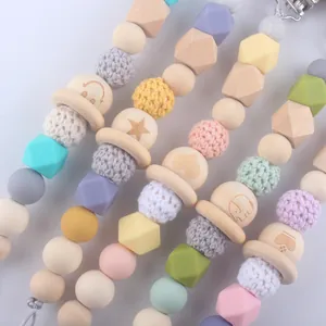 Silicone and wood baby pacifier clip with crochet beads and engraved patterns