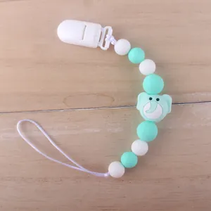 Detail of baby pacifier clip with mint elephant bead and silicone teething beads