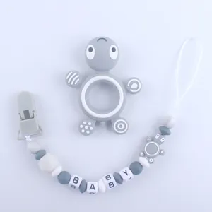 Detailed view of turtle silicone teether set with bead pacifier clip for baby soothing