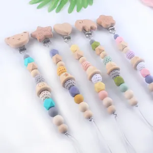 Baby silicone pacifier clip set with wooden animal shapes and colorful crochet beads