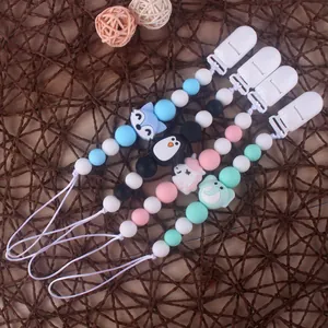 Set of 4 colorful silicone pacifier clips with animal shapes like fox and elephant