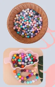 Detailed macro view of 15mm colorful matte silicone beads for DIY pacifier clips