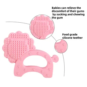 Lion-shaped pink silicone baby teether with textured star patterns and massage bumps