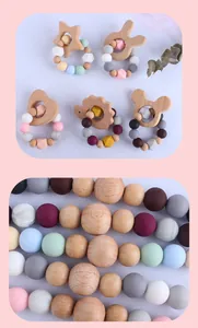 Detail of beech wood animal teethers and colorful silicone beads on pacifier clips