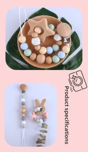 Detail of star-shaped beech wood teether and silicone pacifier clip in Morandi colors