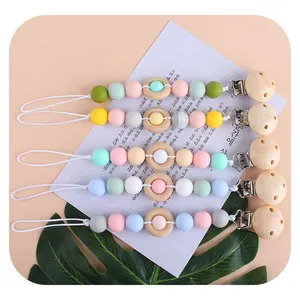 Silicone and wooden baby pacifier clip set with colorful beads in five pastel shades