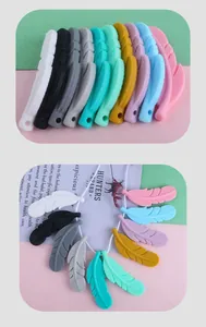 Detail of 10-color silicone feather beads with soft texture and threading holes for DIY chains