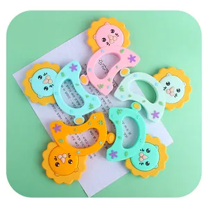 Pastel silicone baby teether set with lion and crescent moon shapes for soothing teething