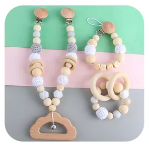 DIY baby teether set with pacifier clip, wooden rings, and cloud bell pendant