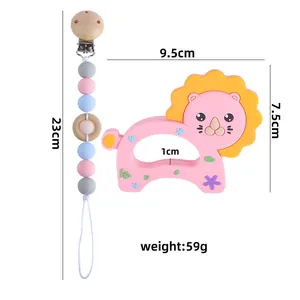 Pink silicone lion baby teether and pacifier clip set with size and weight dimensions