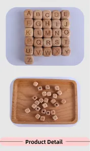 Macro shot of 26 alphabet beech wood beads with holes for DIY pacifier clip making