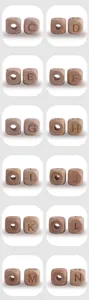 Detailed view of natural beech wood square alphabet beads for DIY baby pacifier clips