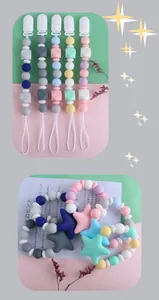 Detailed view of silicone baby pacifier clips with star beads and plastic safety clasp