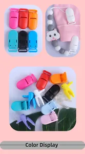 Close-up of colorful plastic pacifier clips in various vibrant shades for DIY baby chains