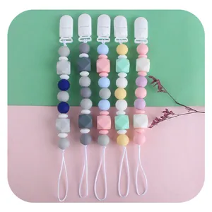 Silicone pacifier clips with star teething beads in pastel colors for infants