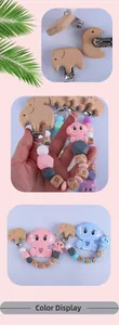 Detail of beech wood elephant pacifier clip with colorful silicone beads and baby letters