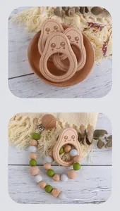 Buchenholz-Avocado-Beißring mit Silikonperlen-Schnullerkette auf einem Holztisch