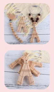 Detail of wooden bird pacifier clip and silicone beads necklace with teepee pendant