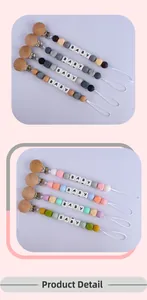 Detail view of beech wood and silicone baby pacifier clip with colorful beads and BABY letters
