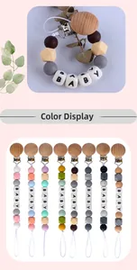 Detailed macro view of multi-color silicone and beech wood baby pacifier clip collection