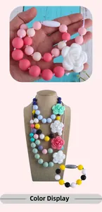 Detail showing silicone rose pendant necklace with colorful beads and safety clasp