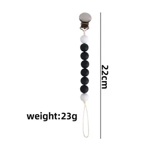 Baby pacifier clip with 22cm silicone beads and iron clip on white background